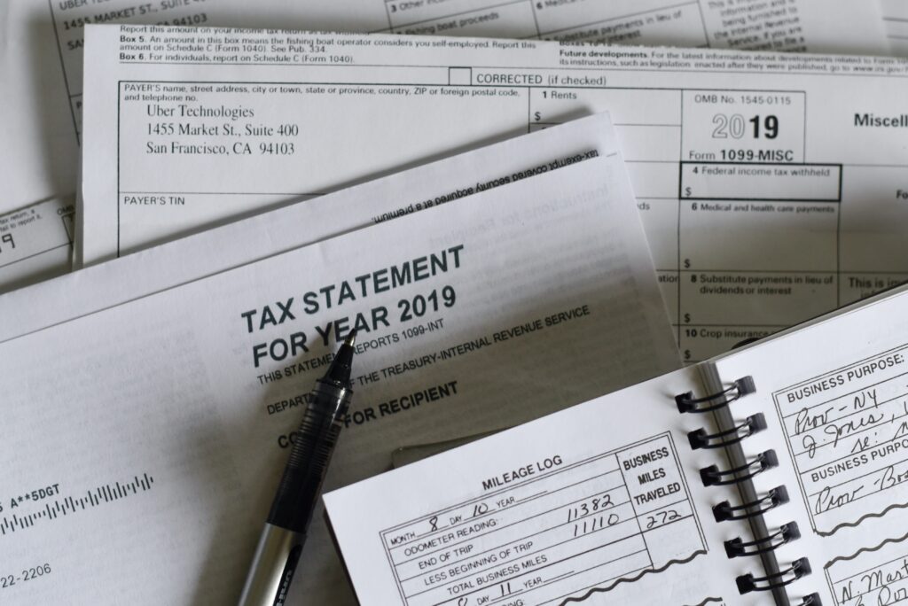 Scattered tax documents, resulting in stressful tax season for financial advisors and accountants. 